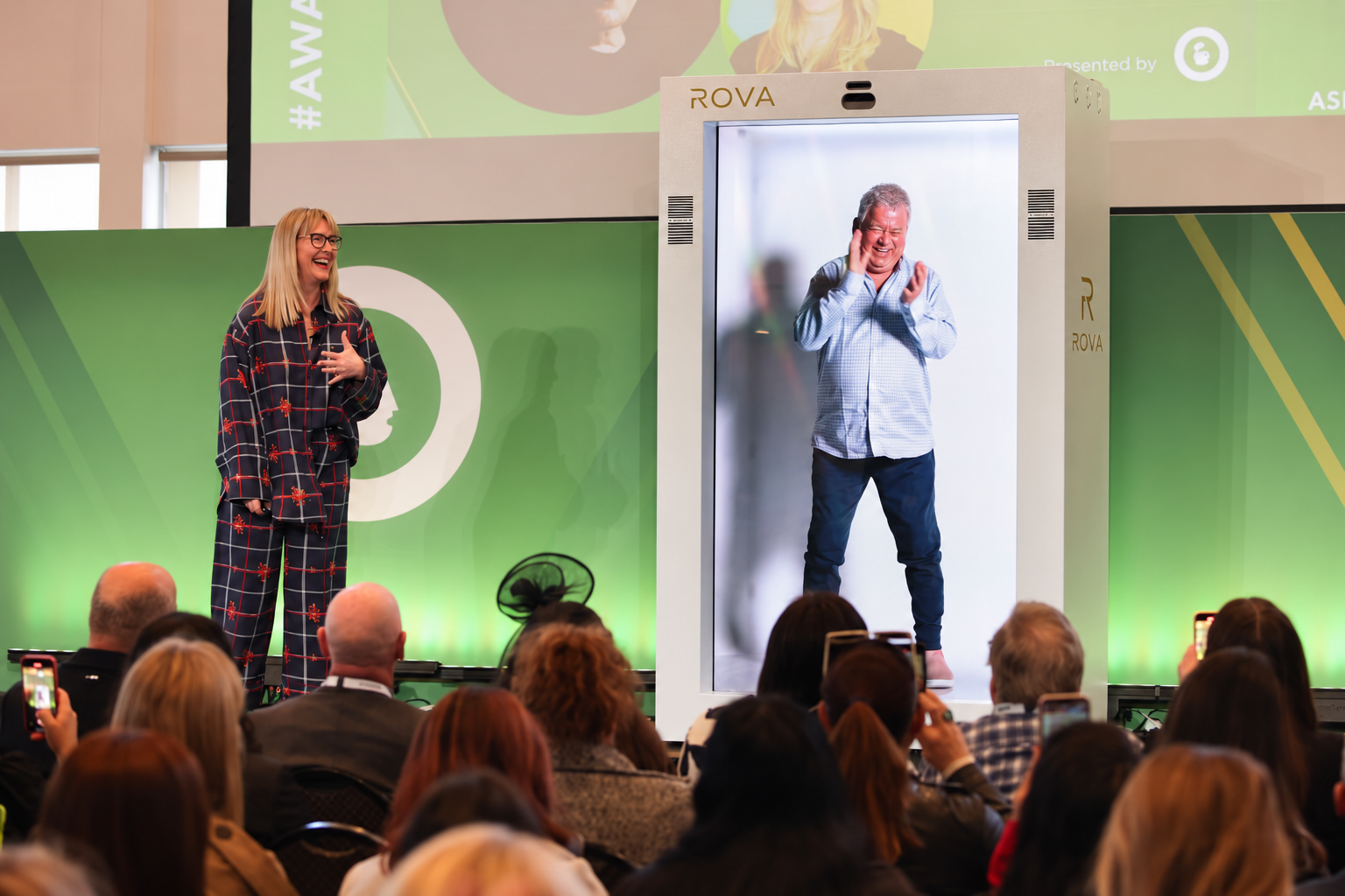 ROVA-branded visualization of a remote speaker appearing onstage